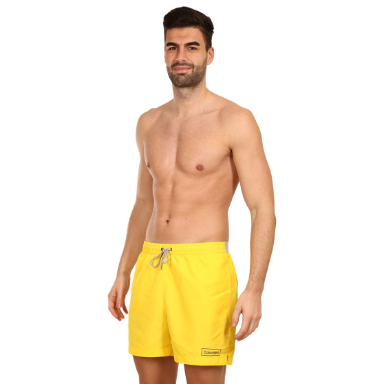 Stroje kąpielowe męskie Calvin Klein żółty (KM0KM00787 ZGR)